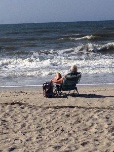 Gwen starring out at the vast oceanscape from a barrier island in North Carolina